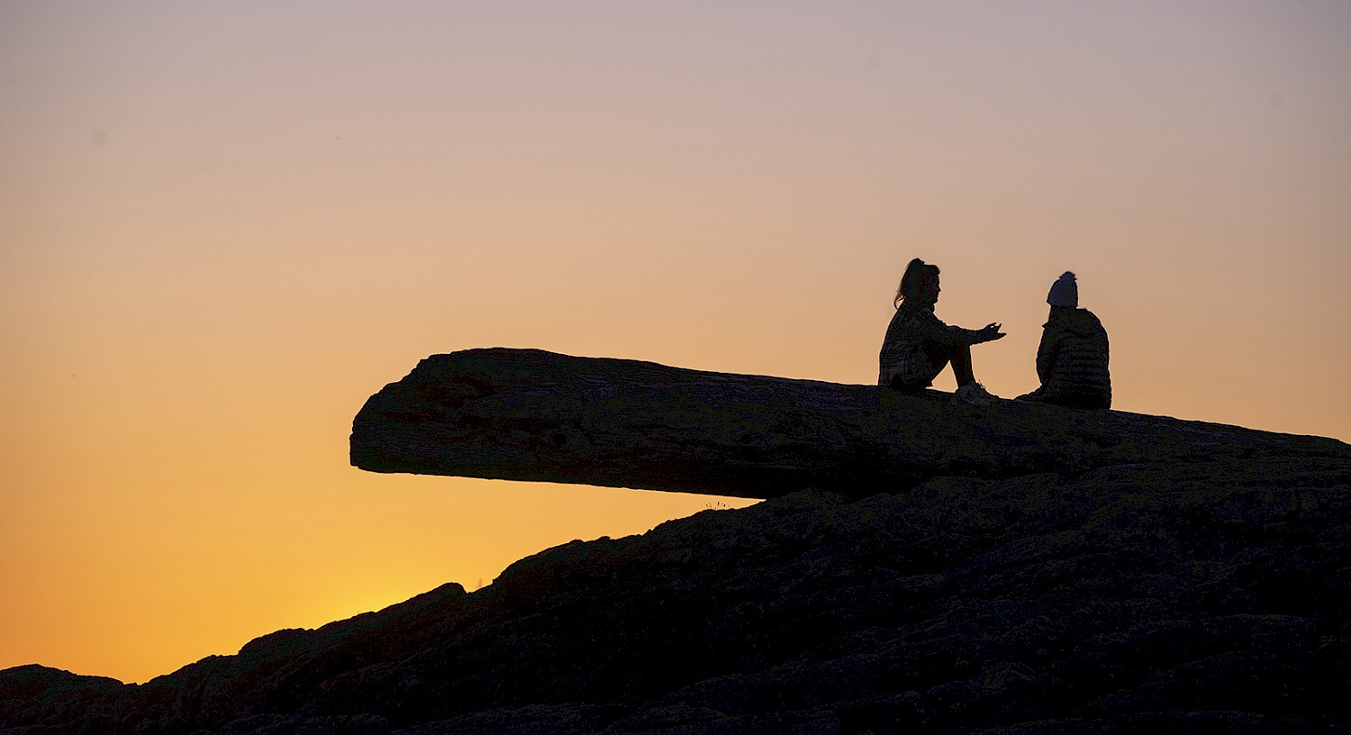 Watching the Sunset on the Chesterman Beach Log by Caitlin Ronda