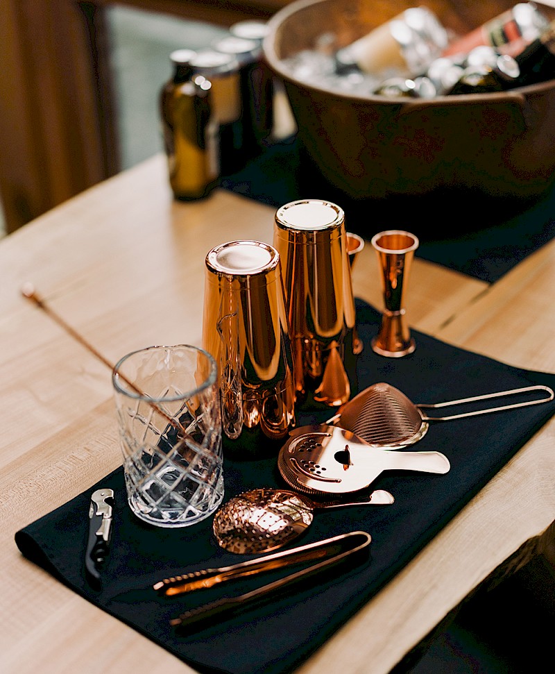 copper bar tools laid out and ready for cocktail creation