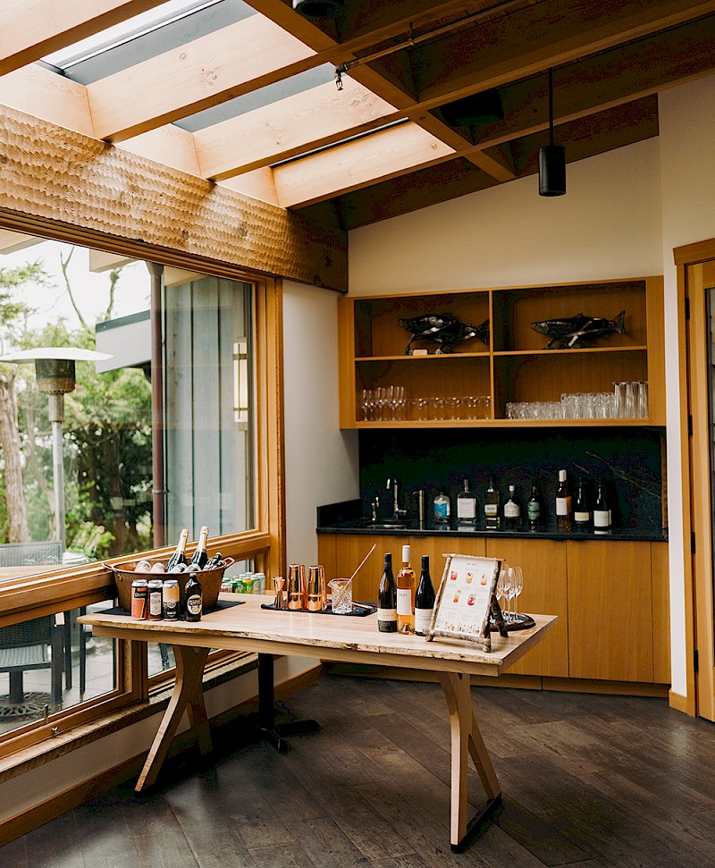 a corner of the shoreline terrace set as a bar for a wedding reception