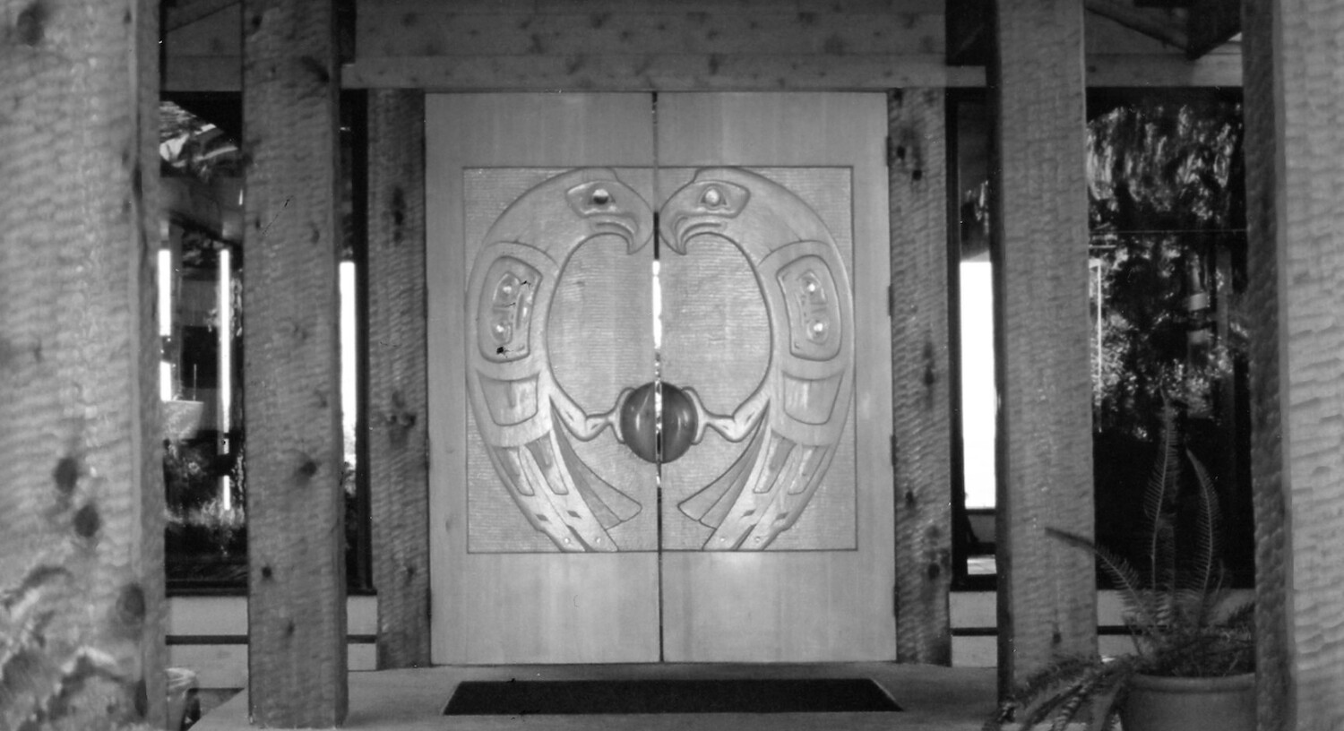 The hand-carved, cedar doors of the Pointe Building shortly after opening.